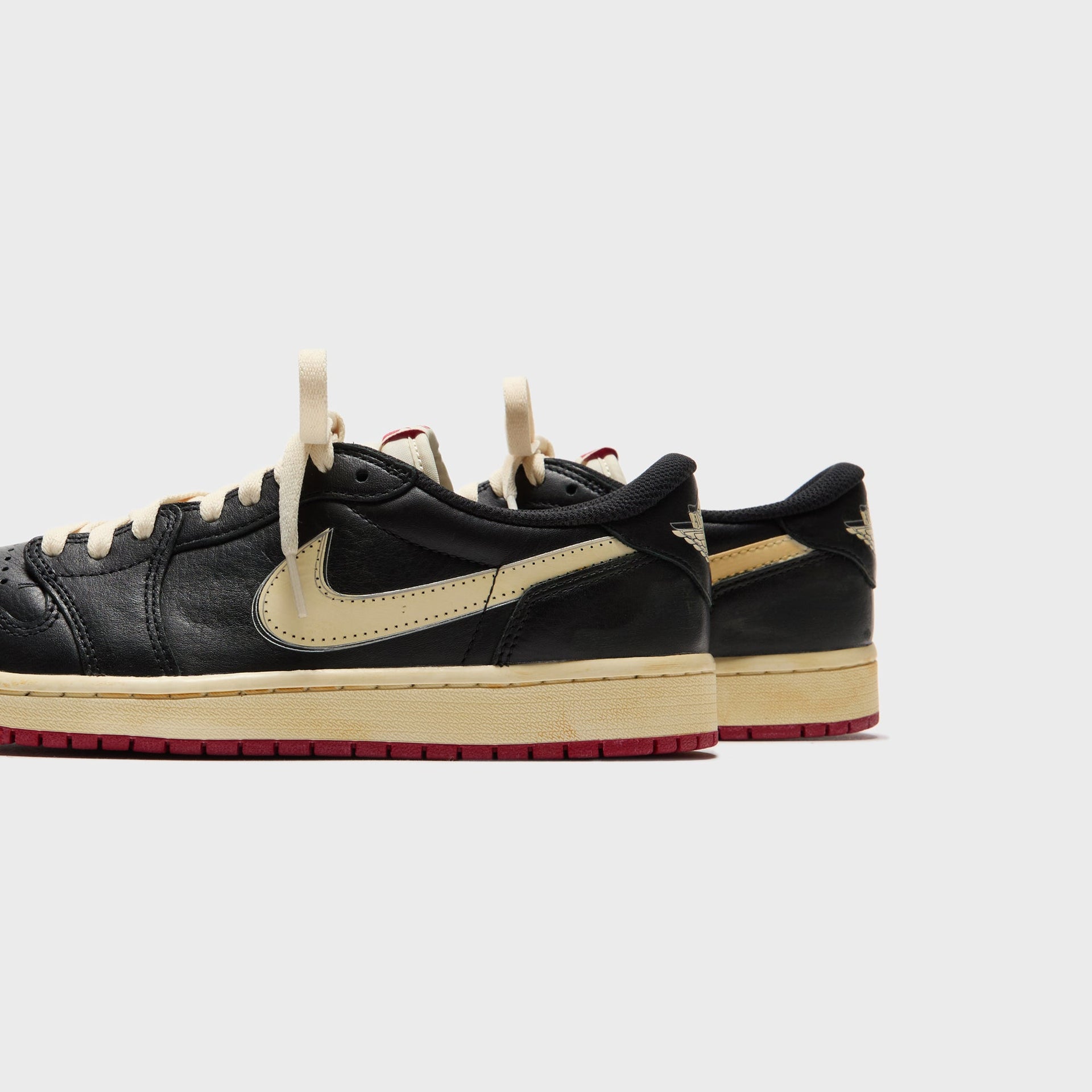 Jordan x Nigel Sylvester Air Jordan 1 Low OG - Nitro Black / Muslin / Varsity Red