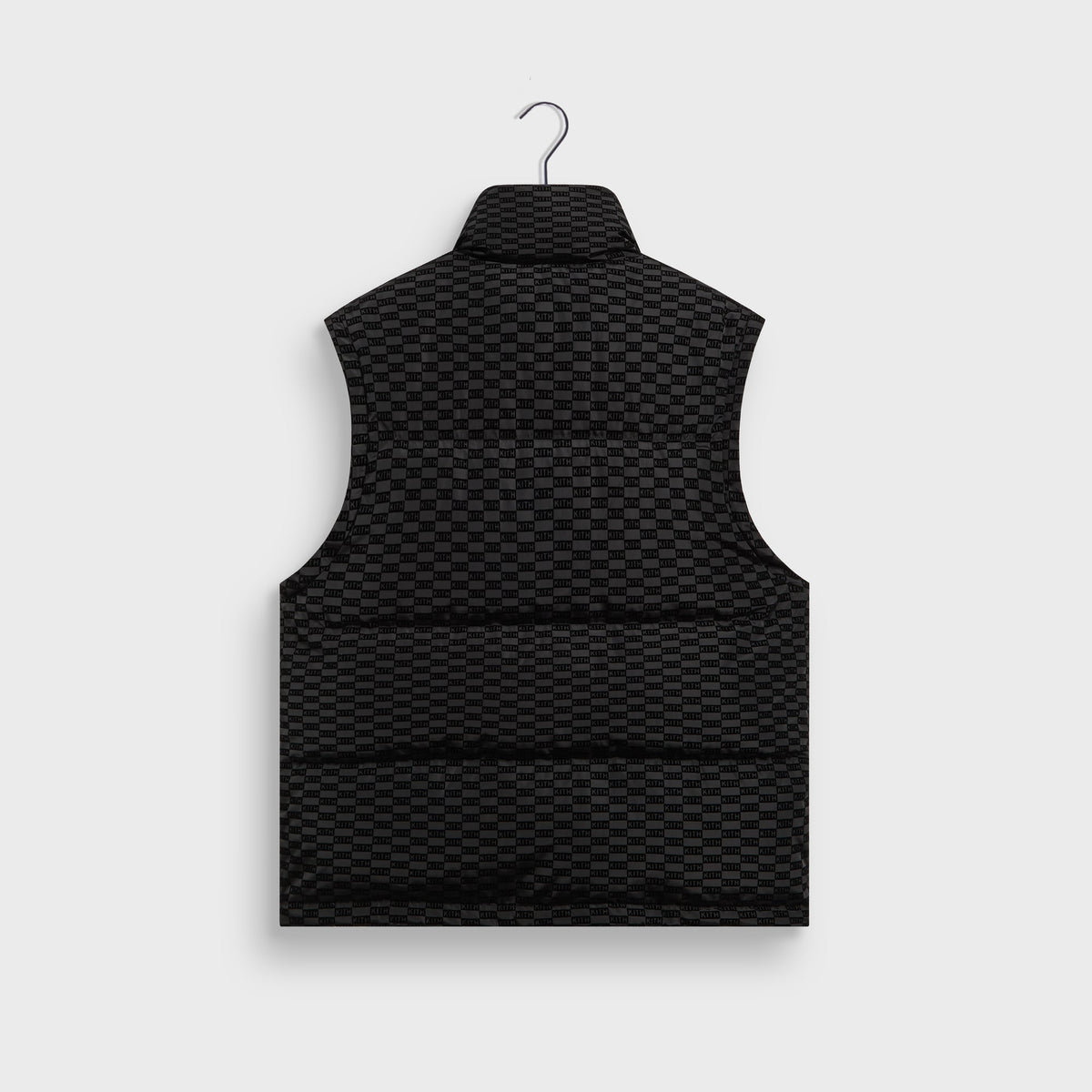 Kith Flocked Monogram Westley Convertible Puffer as a vest in black, back view, with tonal monogram flocking