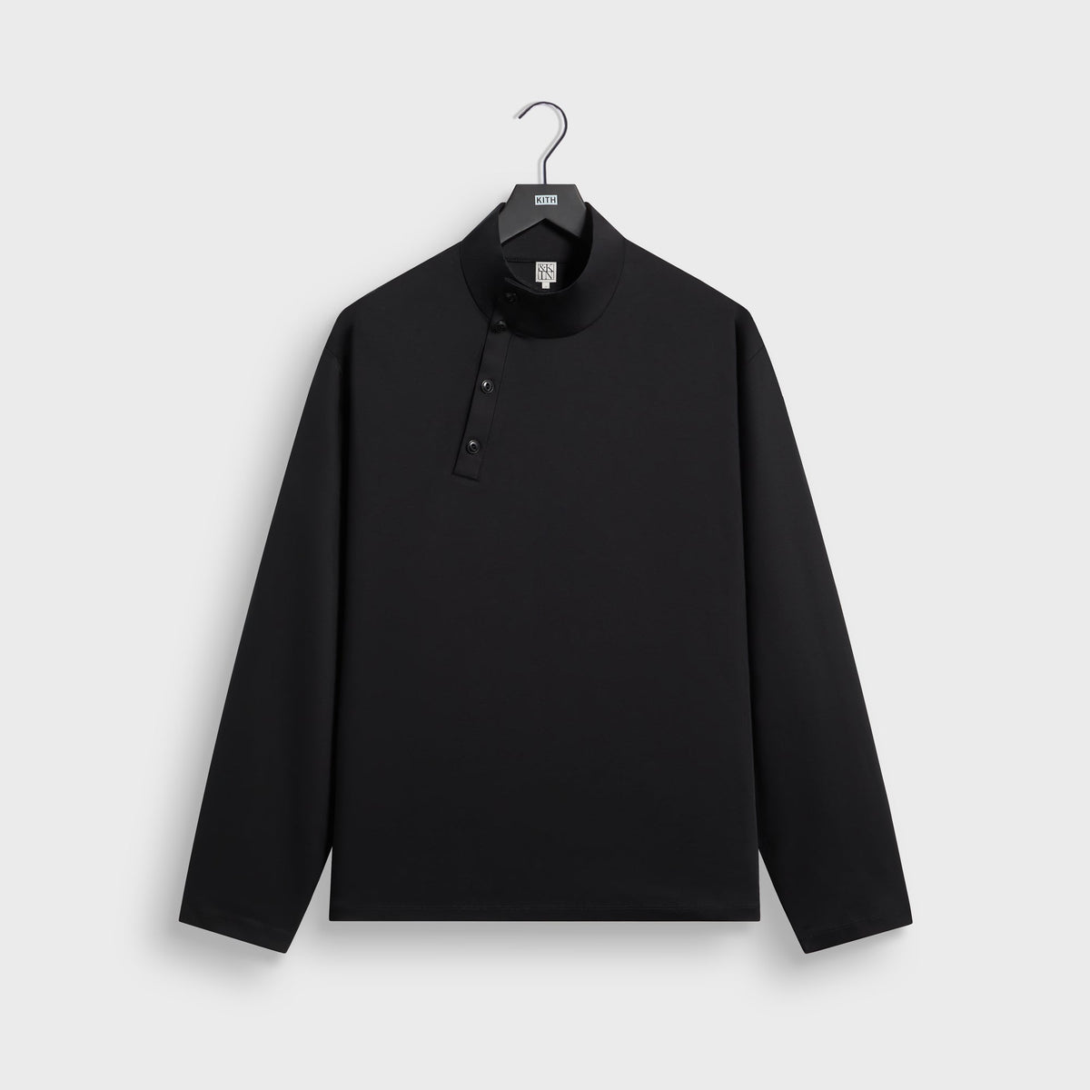 &Kin Interlock Cyrus Turtleneck in black, front view, mock-neck top with snap-button placket
