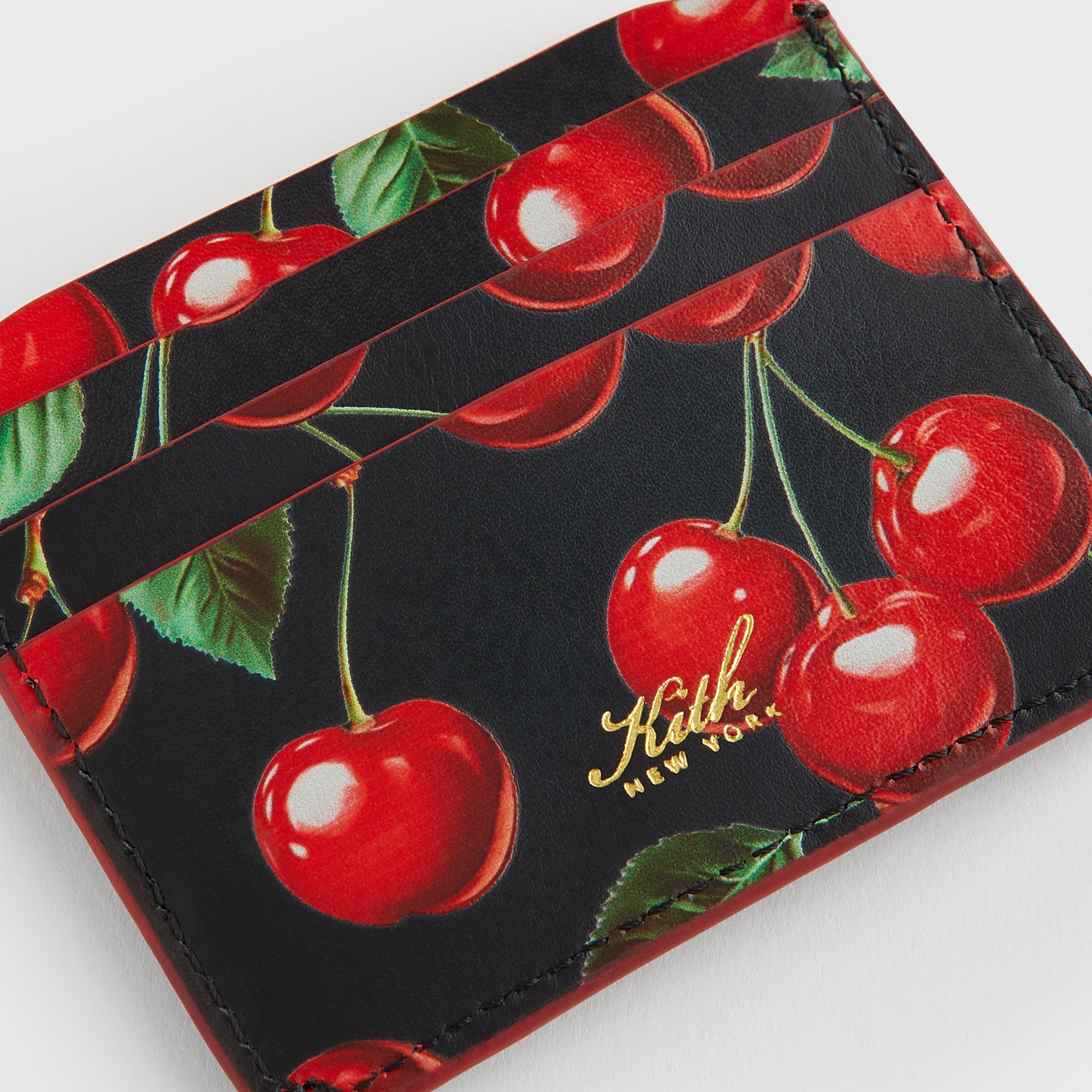 Kith Women Tossed Cherries Notch 6CC Card Case - Black – Kith Europe