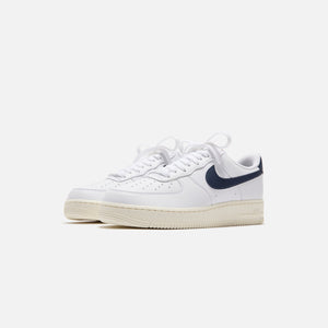 Nike WMNS Air Force 1 07 White Obsidian Pale Ivory Metallic Gol Kith Europe